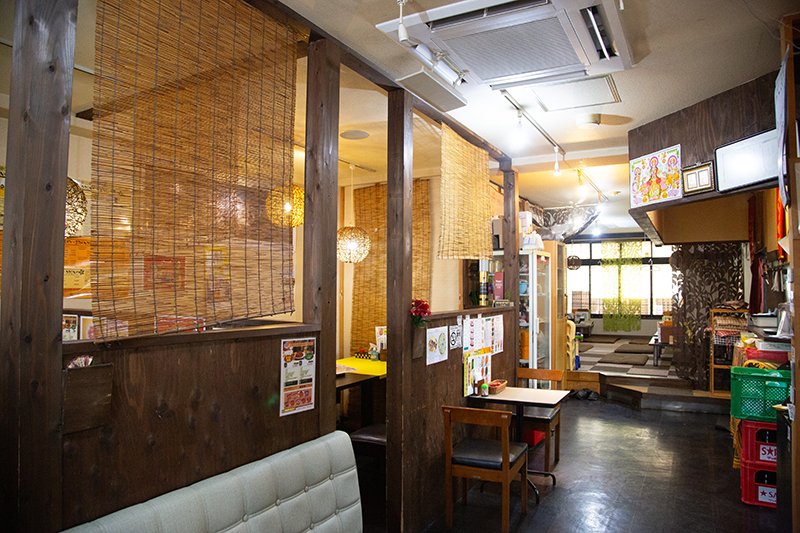 Milan Restaurant inviting interior with bamboo screens and warm pendant lighting